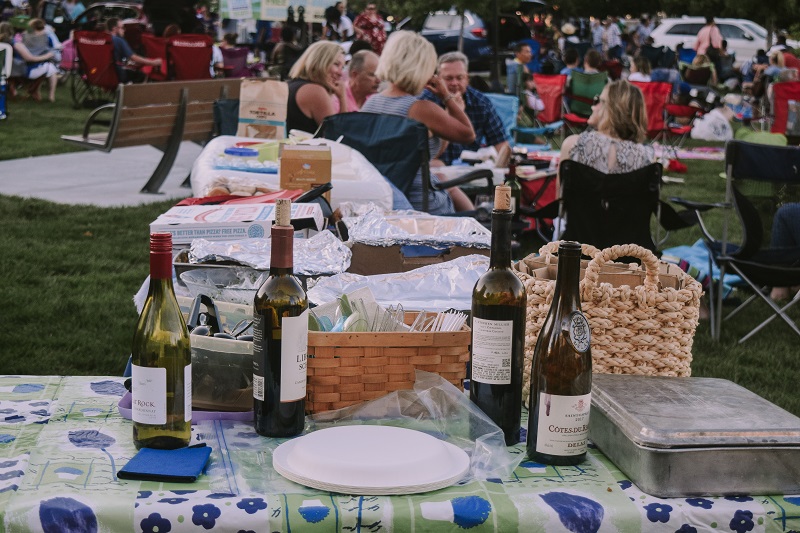 Four bottles of wine sit on a table