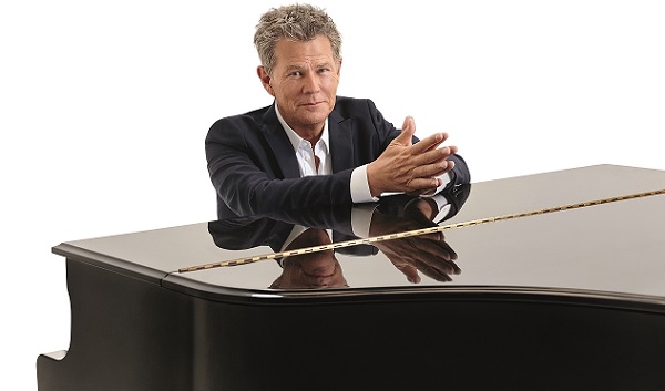 David Foster sits at a piano