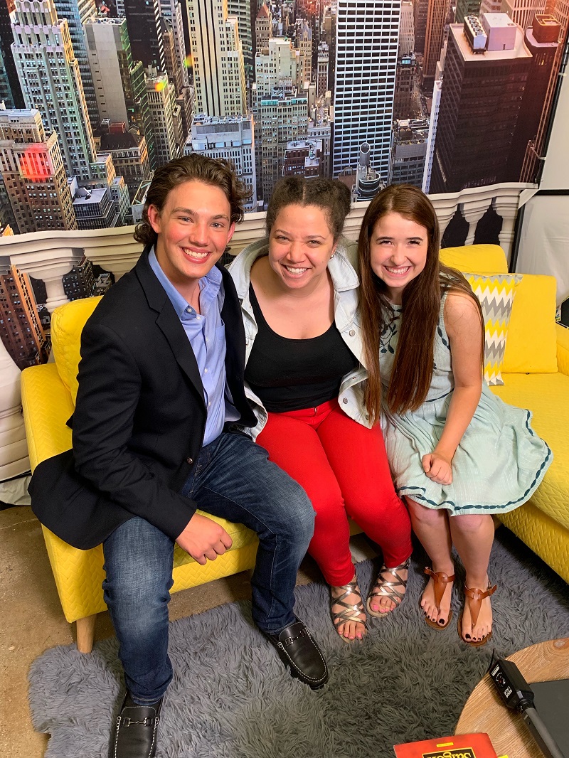 Teen girl poses with two Broadway actors