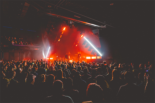 Sold out crowd with Queens of the Stone Age in red light